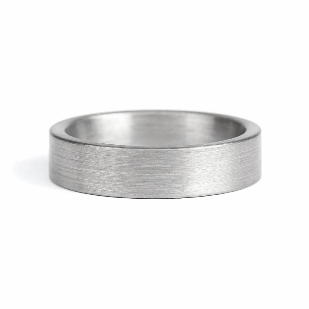 a rugged men's wedding ring crafted from an authentic shotgun barrel. Made in the USA, this unique ring is designed for hunters and outdoorsmen who live for the hunt. A perfect symbol of commitment with an edge of adventure.