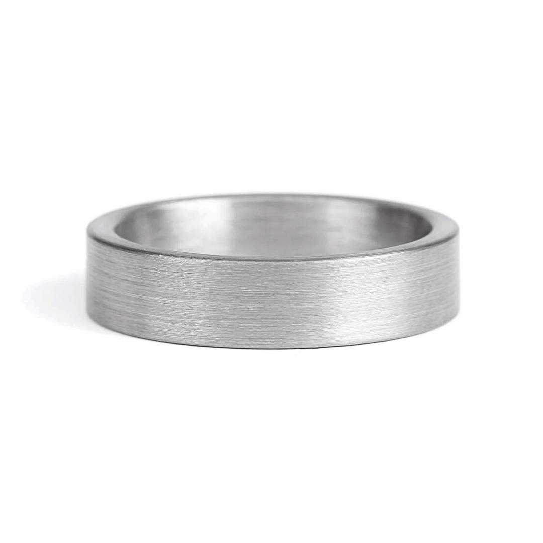a rugged men's wedding ring crafted from an authentic shotgun barrel. Made in the USA, this unique ring is designed for hunters and outdoorsmen who live for the hunt. A perfect symbol of commitment with an edge of adventure.