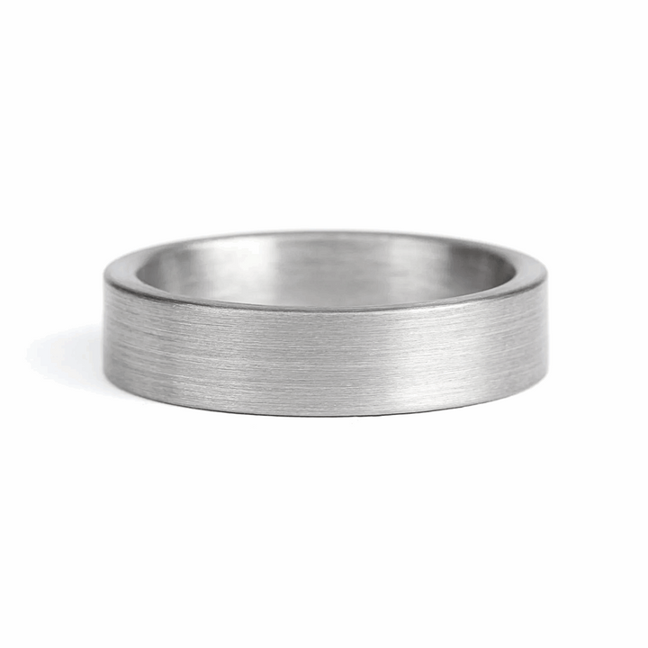 a rugged men's wedding ring crafted from an authentic shotgun barrel. Made in the USA, this unique ring is designed for hunters and outdoorsmen who live for the hunt. A perfect symbol of commitment with an edge of adventure.