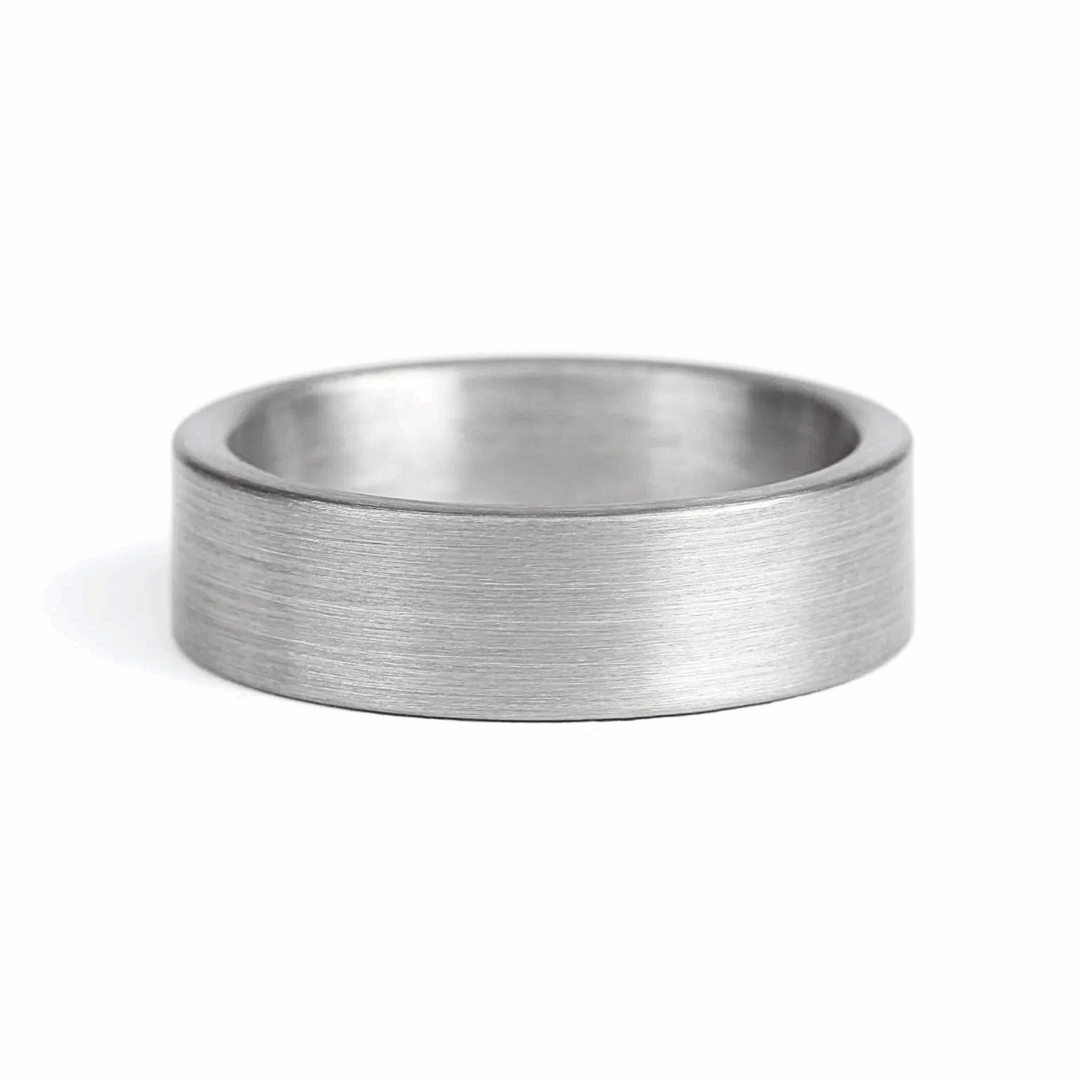 a rugged men's wedding ring crafted from an authentic shotgun barrel. Made in the USA, this unique ring is designed for hunters and outdoorsmen who live for the hunt. A perfect symbol of commitment with an edge of adventure.