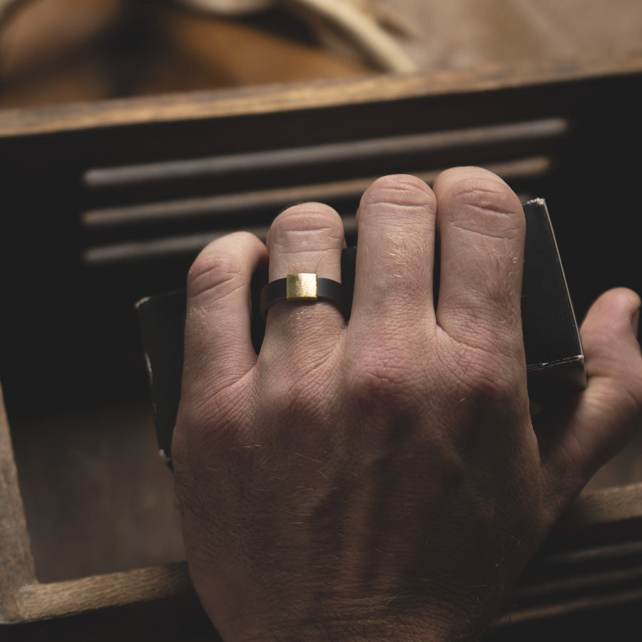 7MM gunmetal with 14Kt. Brushed Yellow Gold insert Barrel Band on hand