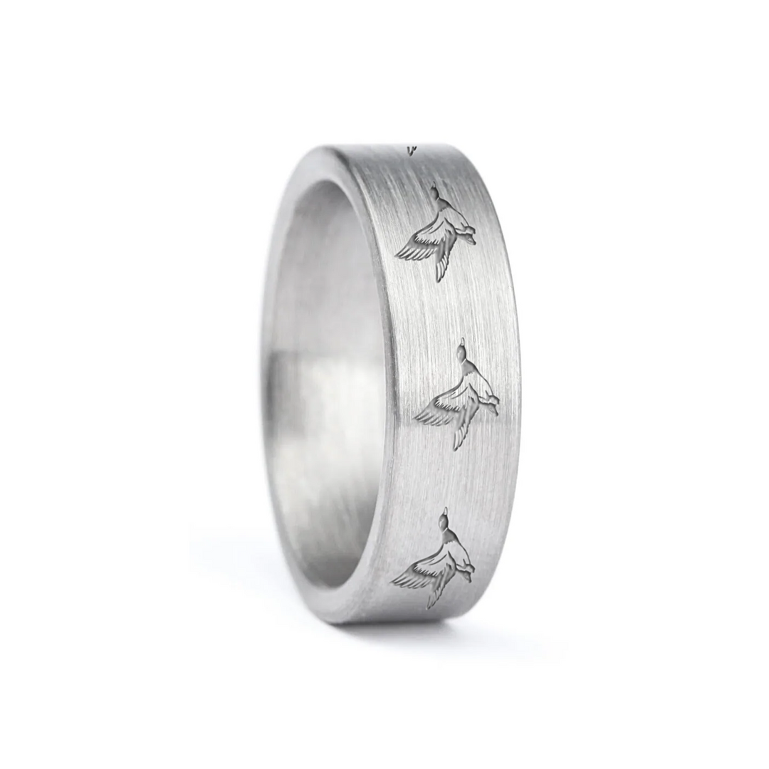 a rugged men's wedding ring crafted from an authentic shotgun barrel. Made in the USA, this unique ring is designed for hunters and outdoorsmen who live for the hunt. A perfect symbol of commitment with an edge of adventure.
