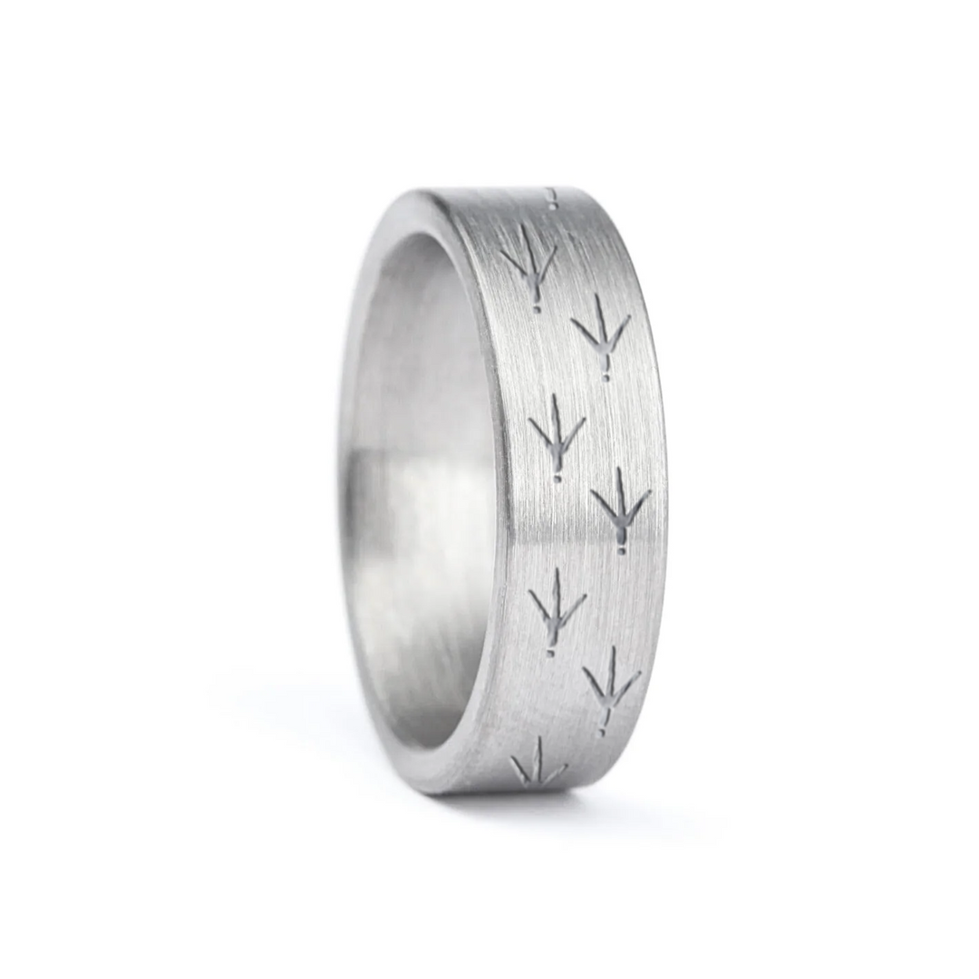 a rugged men's wedding ring crafted from an authentic shotgun barrel. Made in the USA, this unique ring is designed for hunters and outdoorsmen who live for the hunt. A perfect symbol of commitment with an edge of adventure.
