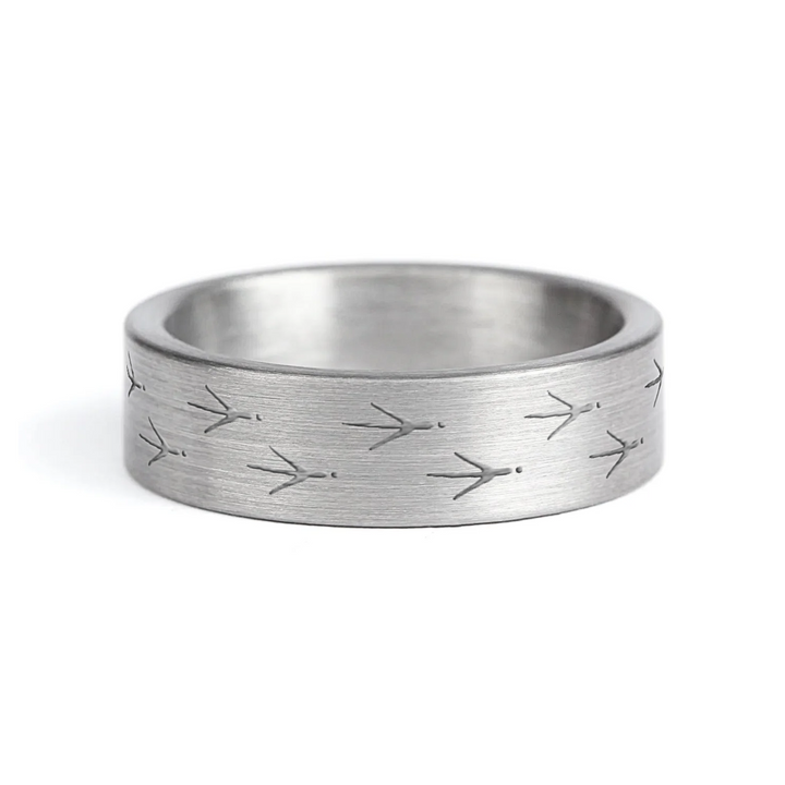 a rugged men's wedding ring crafted from an authentic shotgun barrel. Made in the USA, this unique ring is designed for hunters and outdoorsmen who live for the hunt. A perfect symbol of commitment with an edge of adventure.
