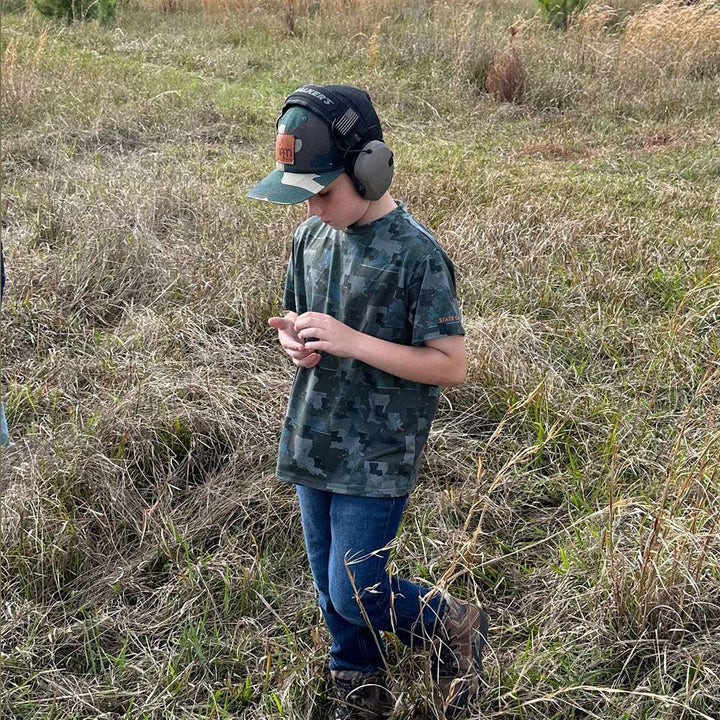 Kid’s Louisiana Camo short sleeve shirt featuring a unique camouflage pattern made from the outline of the state of Louisiana. Lightweight, breathable, and perfect for hunting, hiking, or everyday wear.