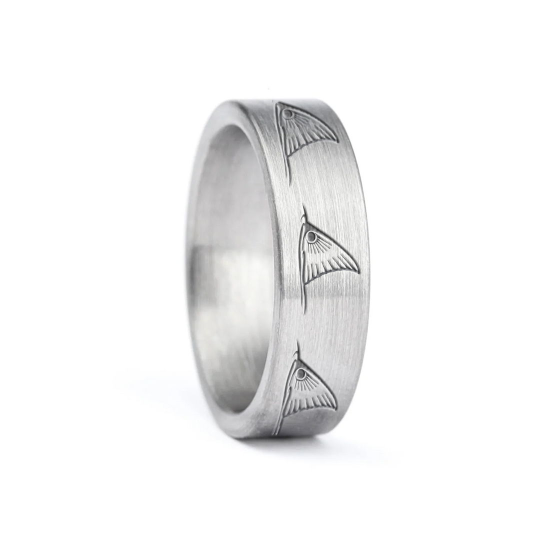 a rugged men's wedding ring crafted from an authentic shotgun barrel. Made in the USA, this unique ring is designed for hunters and outdoorsmen who live for the hunt. A perfect symbol of commitment with an edge of adventure.
