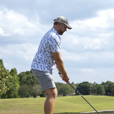 Man playing golf wearing Florida Gator Camo Gameday Men's performance Polo