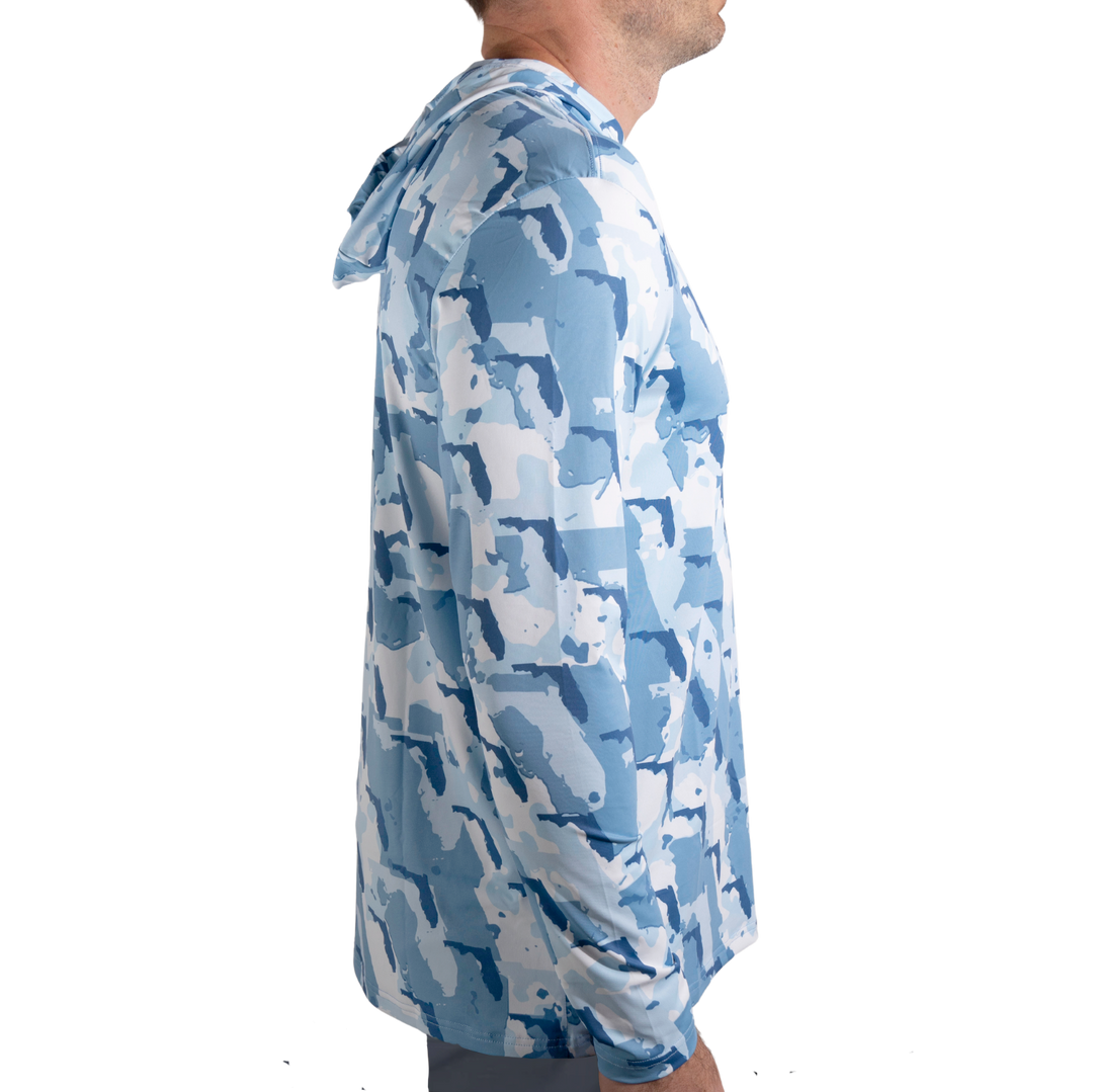 Florida Camo Fishing Long Sleeve Hoodie featuring a unique camouflage pattern made from the outline of the state of Florida . Designed for anglers, hunters, and proud Floridians this lightweight, breathable hoodie offers UV protection and moisture-wicking fabric—perfect for fishing trips, outdoor adventures, and everyday wear.
