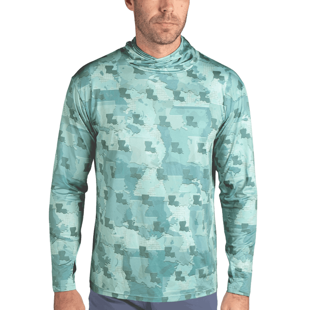 Louisiana Camo Fishing Long Sleeve Hoodie featuring a unique camouflage pattern made from the outline of the state of Louisiana  . Designed for anglers, hunters, and proud Louisianian this lightweight, breathable hoodie offers UV protection and moisture-wicking fabric—perfect for fishing trips, outdoor adventures, and everyday wear.
