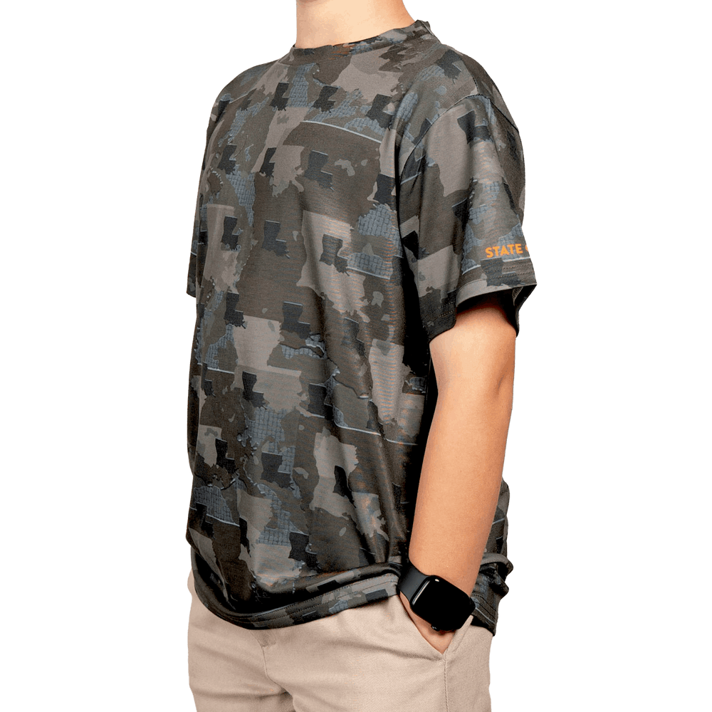 Kid’s Louisiana Camo short sleeve shirt featuring a unique camouflage pattern made from the outline of the state of Louisiana. Lightweight, breathable, and perfect for hunting, hiking, or everyday wear.