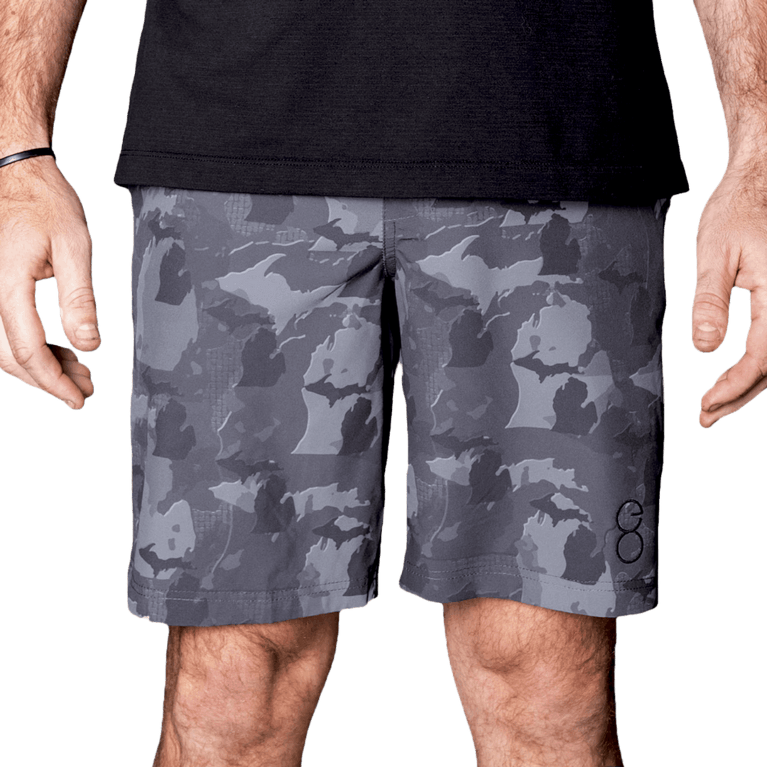 Michigan State Camo Everyday Shorts featuring a one-of-a-kind camo pattern made from the outline of Michigan  Designed for versatility, these lightweight men's shorts are perfect for running, swimming, workouts, and everyday wear. A must-have for Michigan hunters and outdoor enthusiasts who want to rep their state with pride.