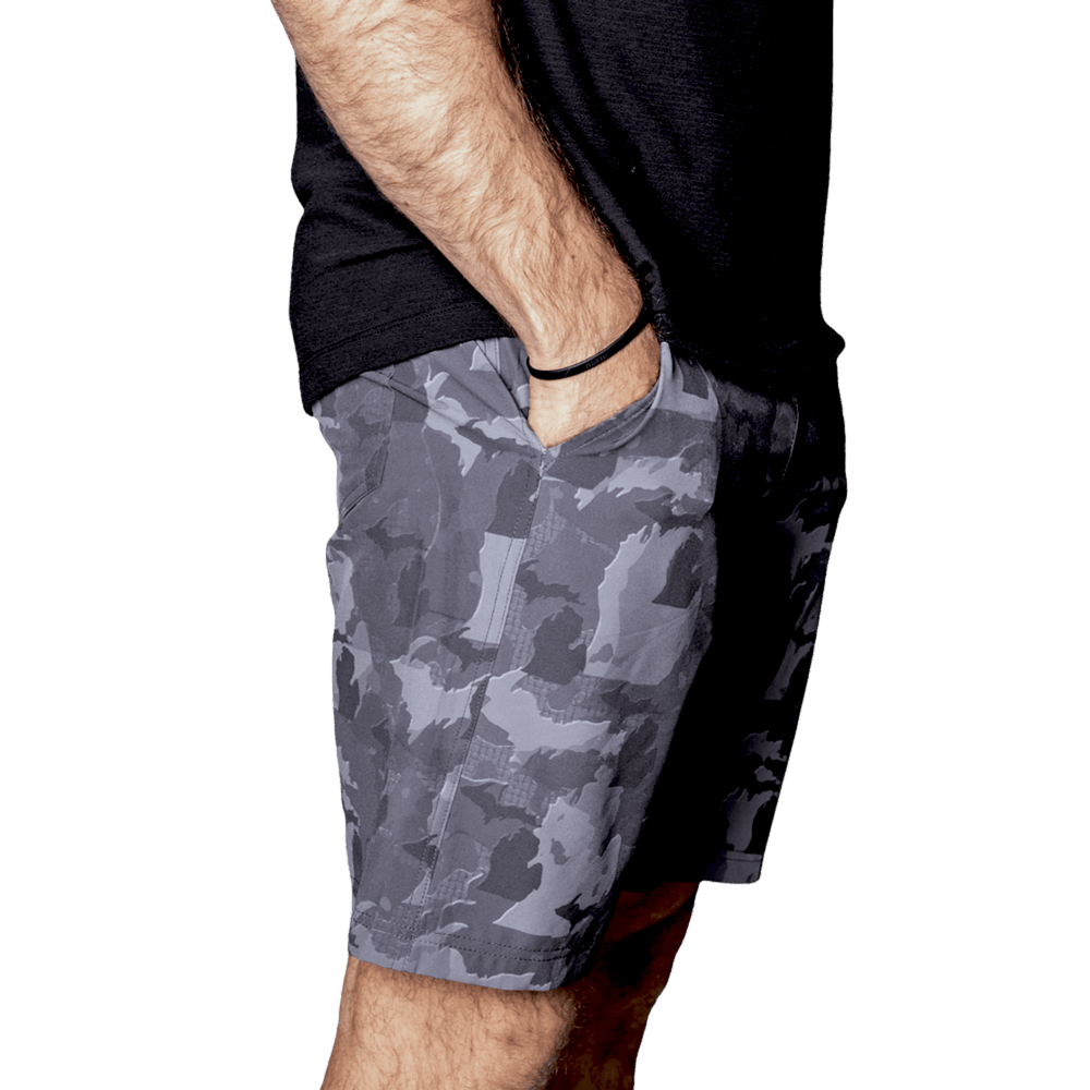 Michigan State Camo Everyday Shorts featuring a one-of-a-kind camo pattern made from the outline of Michigan  Designed for versatility, these lightweight men's shorts are perfect for running, swimming, workouts, and everyday wear. A must-have for Michigan hunters and outdoor enthusiasts who want to rep their state with pride.