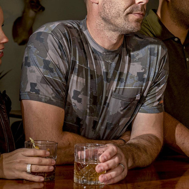 Men’s Louisiana Camo short sleeve shirt featuring a unique camouflage pattern made from the outline of the state of Louisiana Lightweight, breathable, and perfect for hunting, hiking, or everyday wear.