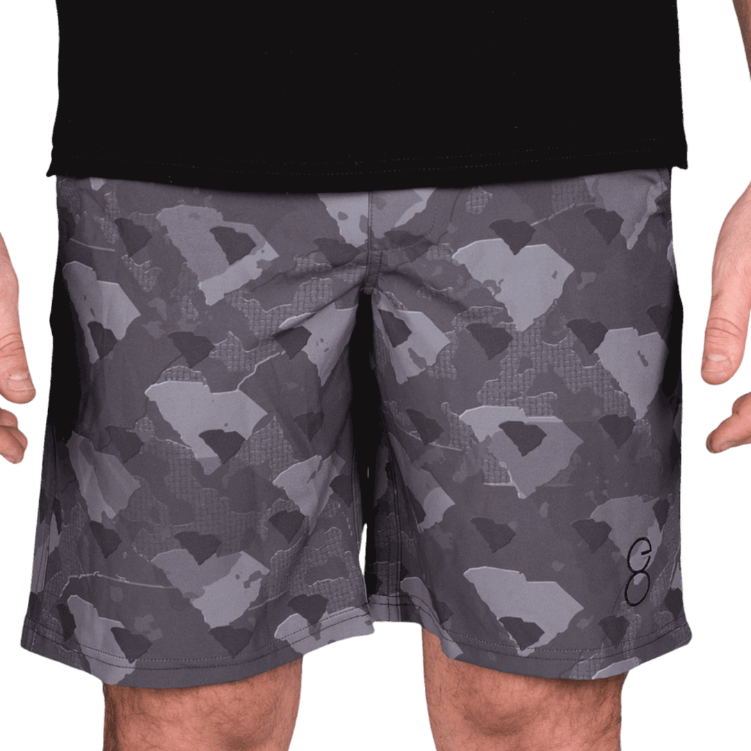 South Carolina State Camo Everyday Shorts featuring a one-of-a-kind camo pattern made from the outline of South Carolina  Designed for versatility, these lightweight men's shorts are perfect for running, swimming, workouts, and everyday wear. A must-have for South Carolina hunters and outdoor enthusiasts who want to rep their state with pride.
