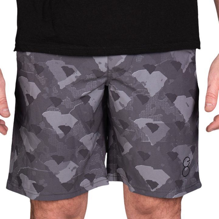 South Carolina State Camo Everyday Shorts featuring a one-of-a-kind camo pattern made from the outline of South Carolina  Designed for versatility, these lightweight men's shorts are perfect for running, swimming, workouts, and everyday wear. A must-have for South Carolina hunters and outdoor enthusiasts who want to rep their state with pride.