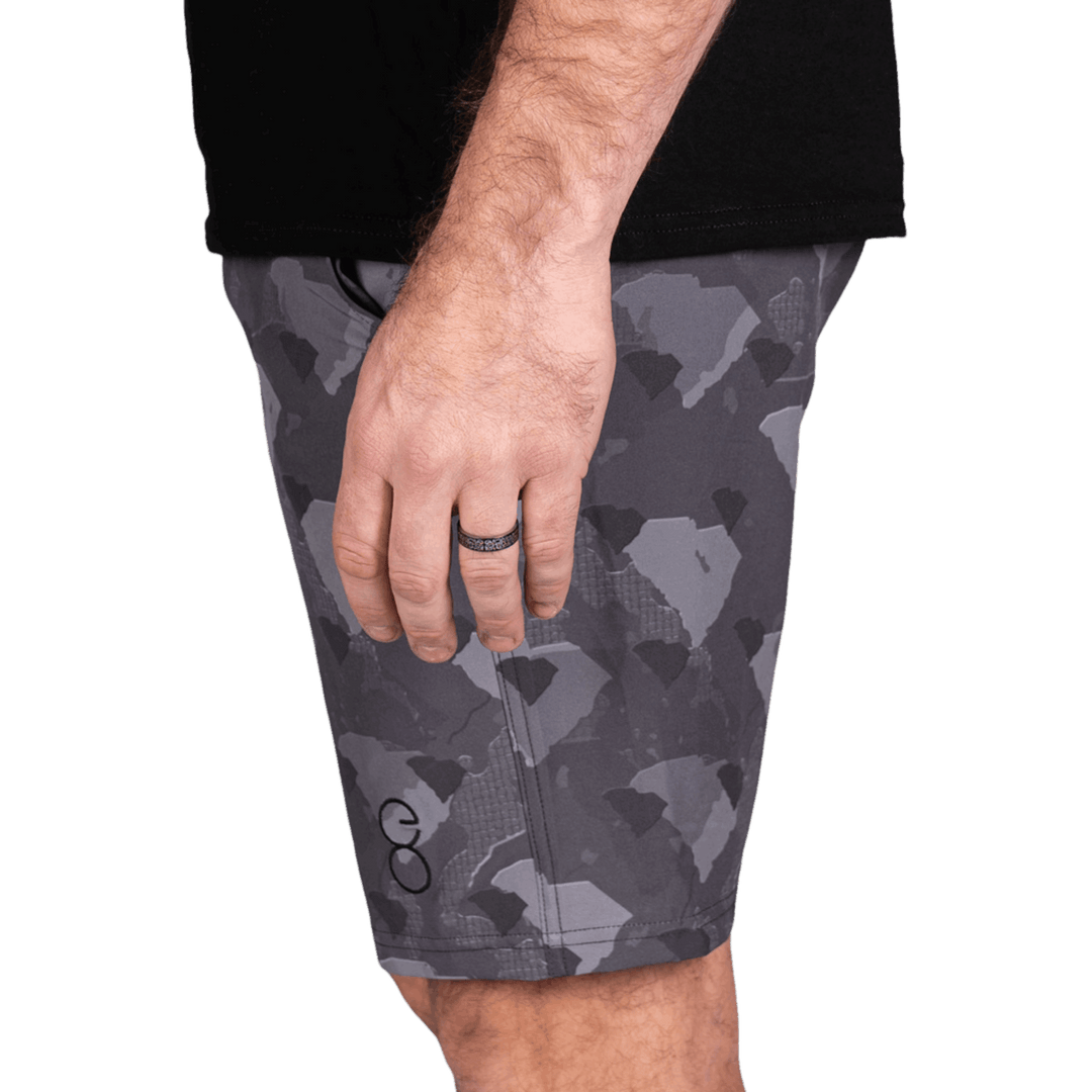 South Carolina State Camo Everyday Shorts featuring a one-of-a-kind camo pattern made from the outline of South Carolina  Designed for versatility, these lightweight men's shorts are perfect for running, swimming, workouts, and everyday wear. A must-have for South Carolina hunters and outdoor enthusiasts who want to rep their state with pride.