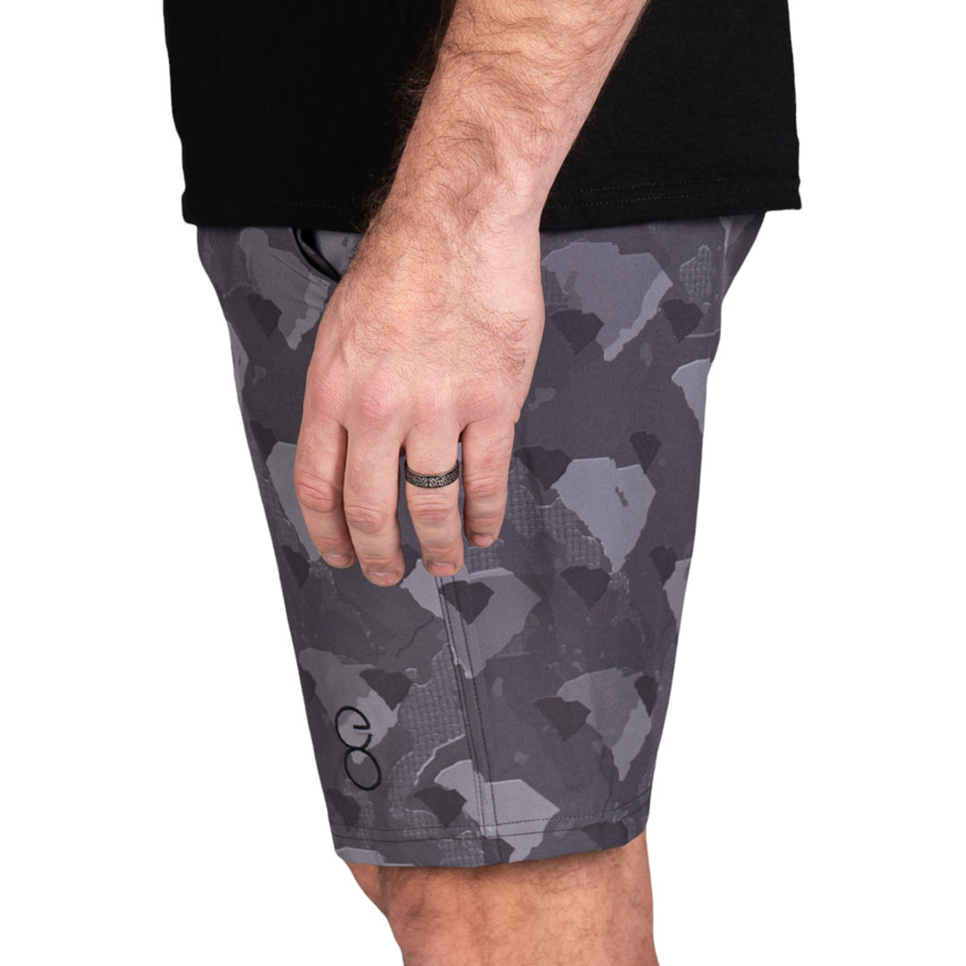 South Carolina State Camo Everyday Shorts featuring a one-of-a-kind camo pattern made from the outline of South Carolina  Designed for versatility, these lightweight men's shorts are perfect for running, swimming, workouts, and everyday wear. A must-have for South Carolina hunters and outdoor enthusiasts who want to rep their state with pride.