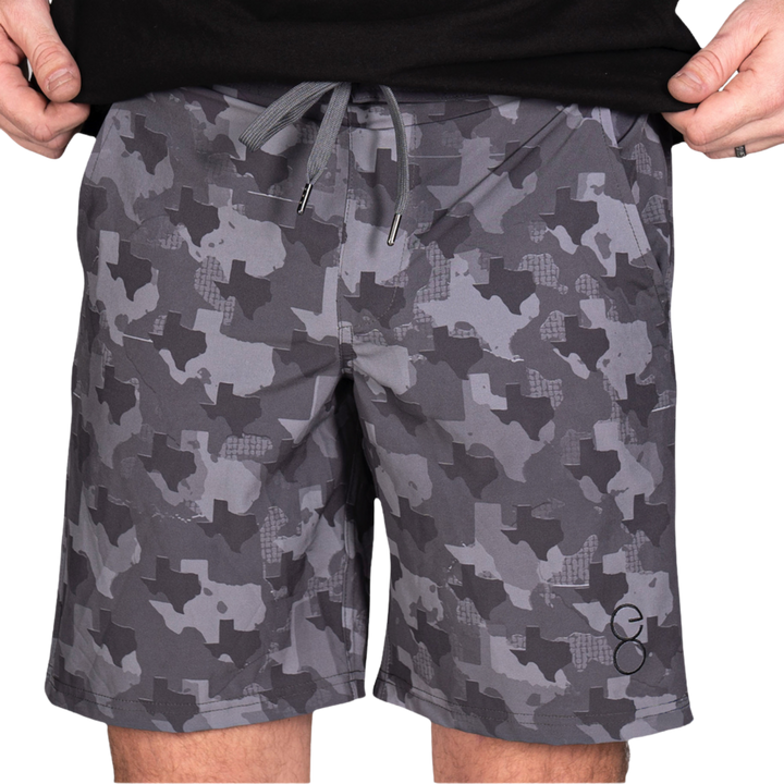 Texas State Camo Everyday Shorts featuring a one-of-a-kind camo pattern made from the outline of Texas.  Designed for versatility, these lightweight men's shorts are perfect for running, swimming, workouts, and everyday wear. A must-have for Texas hunters and outdoor enthusiasts who want to rep their state with pride.