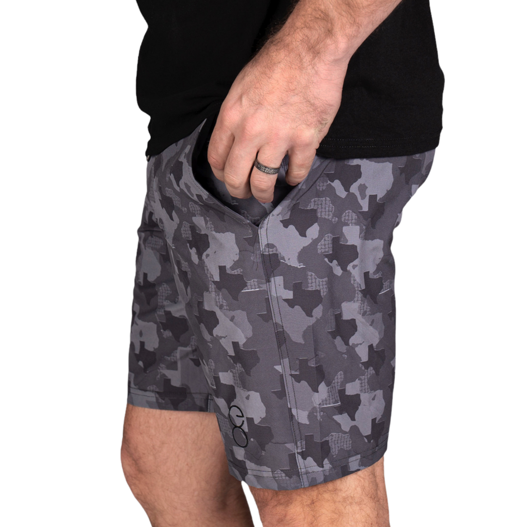 Texas State Camo Everyday Shorts featuring a one-of-a-kind camo pattern made from the outline of Texas.  Designed for versatility, these lightweight men's shorts are perfect for running, swimming, workouts, and everyday wear. A must-have for Texas hunters and outdoor enthusiasts who want to rep their state with pride.