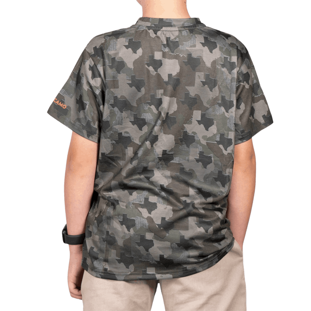 Kid’s Texas Camo short sleeve shirt featuring a unique camouflage pattern made from the outline of the state of Texas Lightweight, breathable, and perfect for hunting, hiking, or everyday wear.