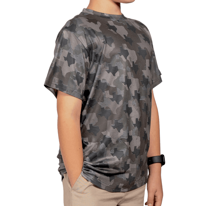 Kid’s Texas Camo short sleeve shirt featuring a unique camouflage pattern made from the outline of the state of Texas Lightweight, breathable, and perfect for hunting, hiking, or everyday wear.