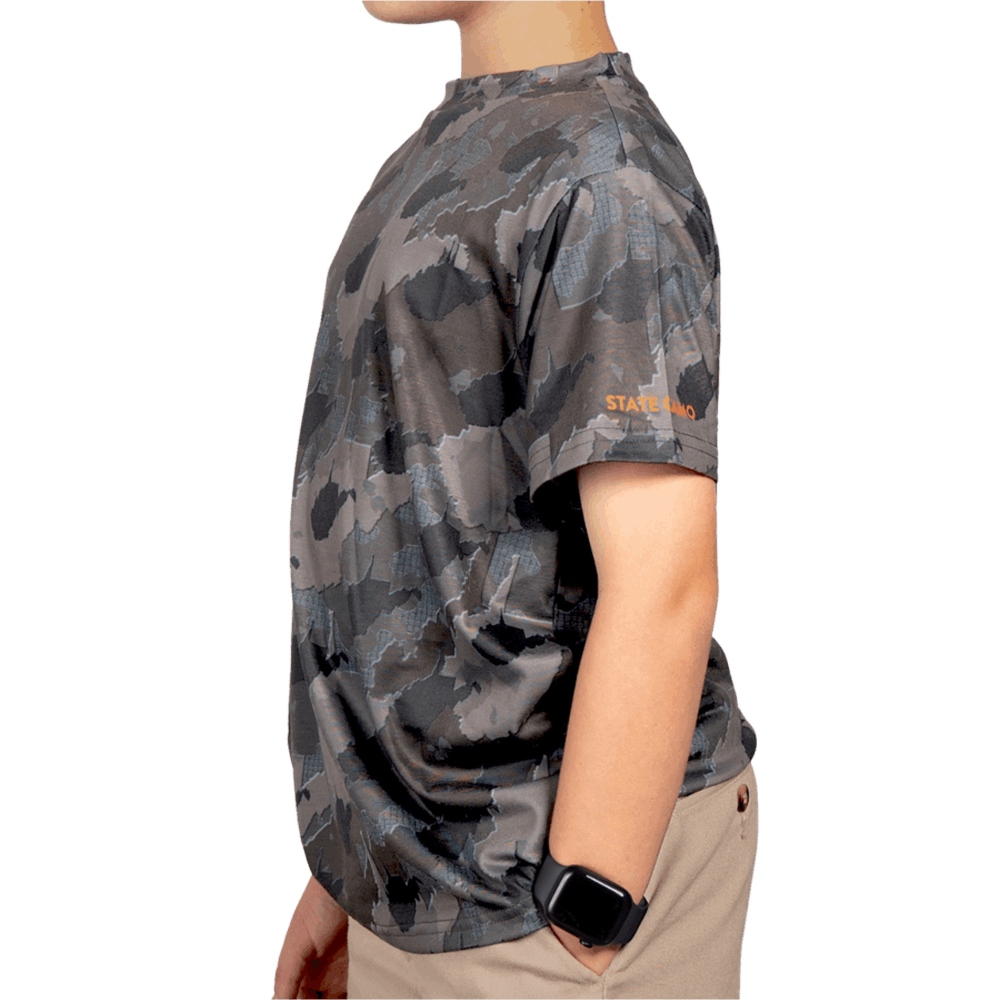 Kid’s West Virginia Camo short sleeve shirt featuring a unique camouflage pattern made from the outline of the state of West Virginia Lightweight, breathable, and perfect for hunting, hiking, or everyday wear.