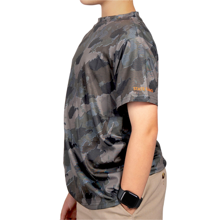 Kid’s West Virginia Camo short sleeve shirt featuring a unique camouflage pattern made from the outline of the state of West Virginia Lightweight, breathable, and perfect for hunting, hiking, or everyday wear.