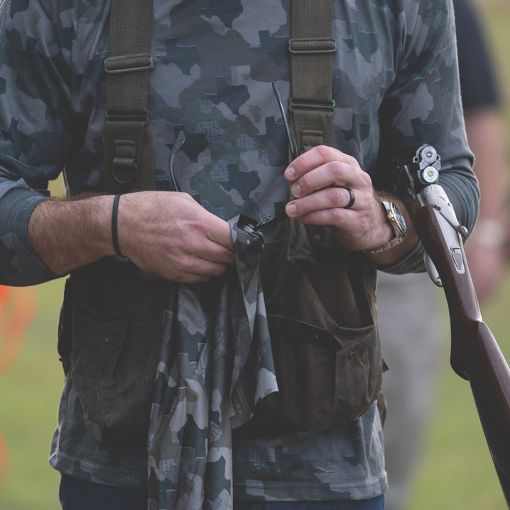 Man cleaning glasses with Texas Camo microfiber field towel - Everyday Outdoors.