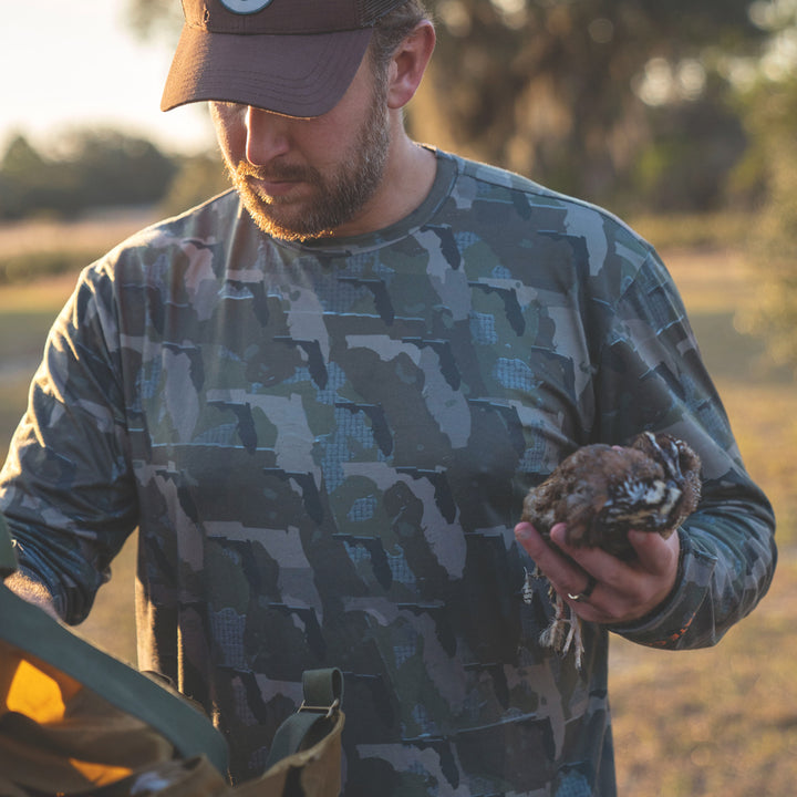 Man hunting in Everyday Outdoors Florida State Camo Men's Long Sleeve Shirt