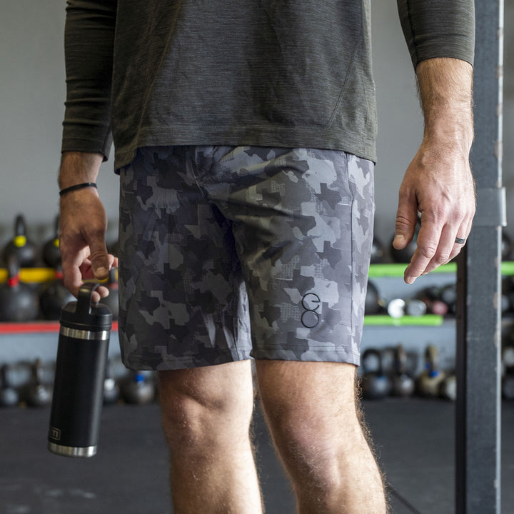 Texas State Camo Everyday Shorts featuring a one-of-a-kind camo pattern made from the outline of Texas.  Designed for versatility, these lightweight men's shorts are perfect for running, swimming, workouts, and everyday wear. A must-have for Texas hunters and outdoor enthusiasts who want to rep their state with pride.