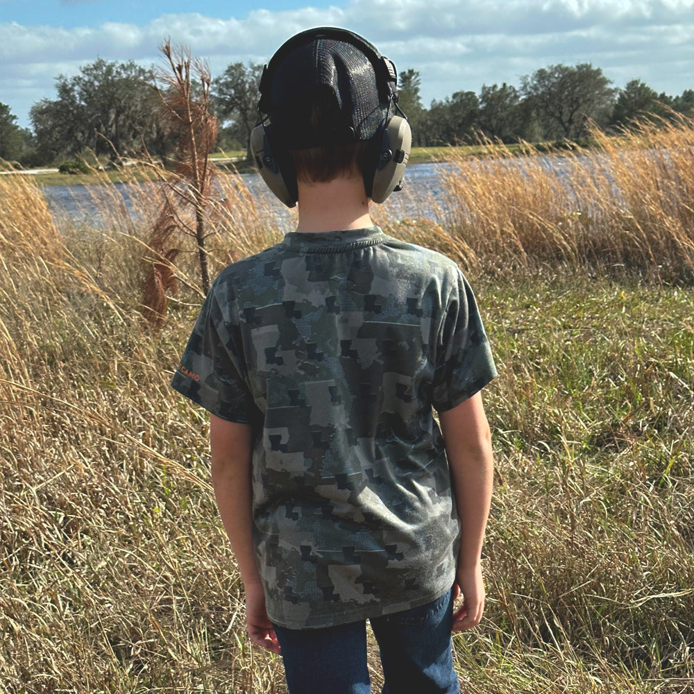 Kid wearing Louisiana State Camo short sleeve shirt